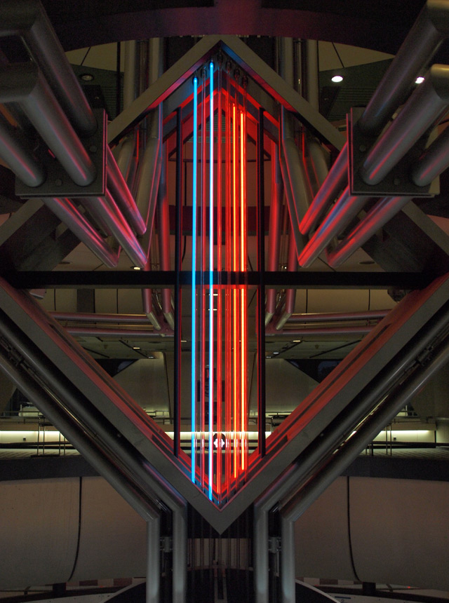 A sculpture made of pipes and neon lights inside the ICC Berlin.