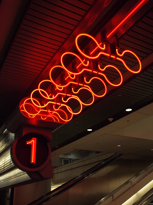 Red neon lights inside the ICC Berlin.